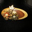 Broche Hout verkocht